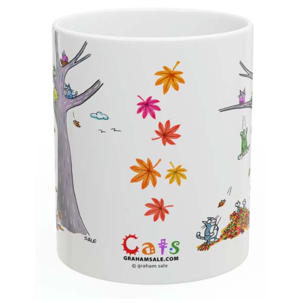 cats jumping in leaves mug